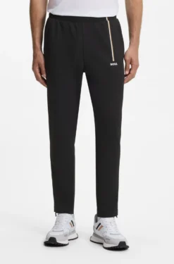 Active tracksuit bottoms in thermoregulating stretch gabardine