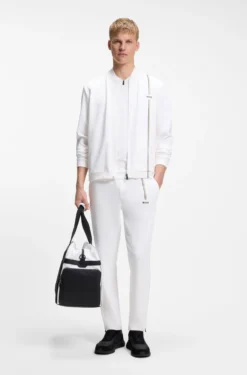 Active tracksuit bottoms in thermoregulating stretch gabardine