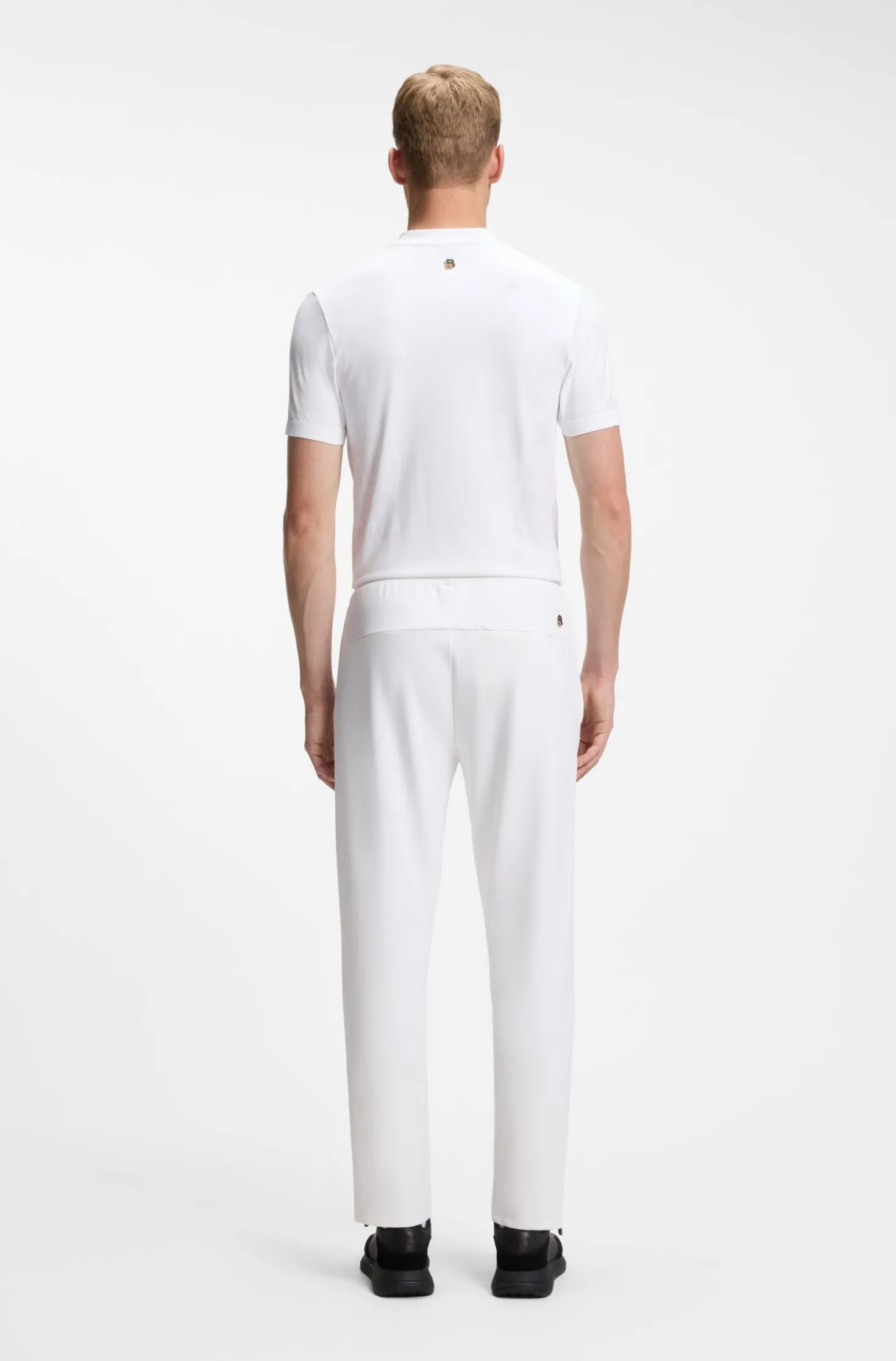 Active tracksuit bottoms in thermoregulating stretch gabardine