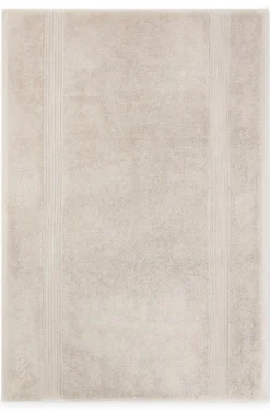 Beige Aegean-cotton bath mat with tonal logo