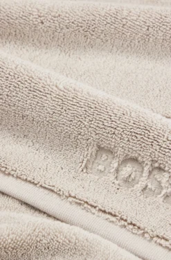 Beige Aegean-cotton bath mat with tonal logo