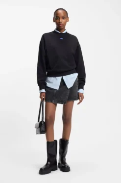Black-denim skirt with asymmetric waistband