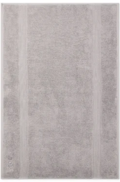 Cotton bath mat in silver with embroidered logo