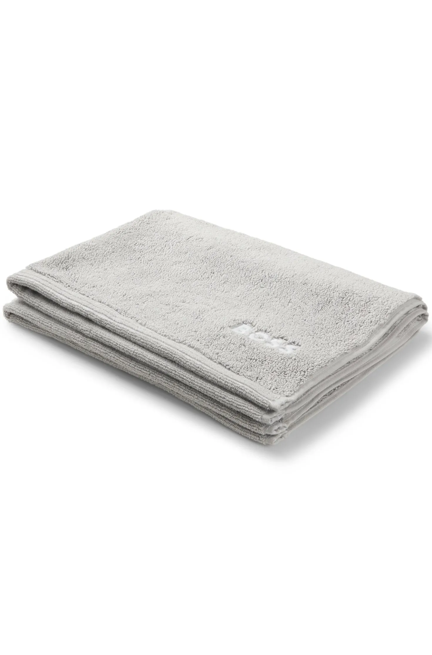 Cotton bath mat with contrast embroidered logo