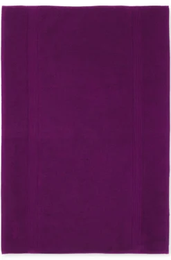 Cotton bath mat with embroidered logo