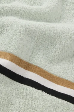 Cotton bath towel with signature-stripe border