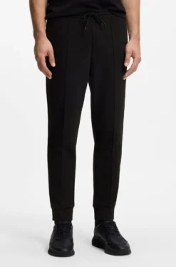 Cotton-blend tracksuit bottoms with piping details