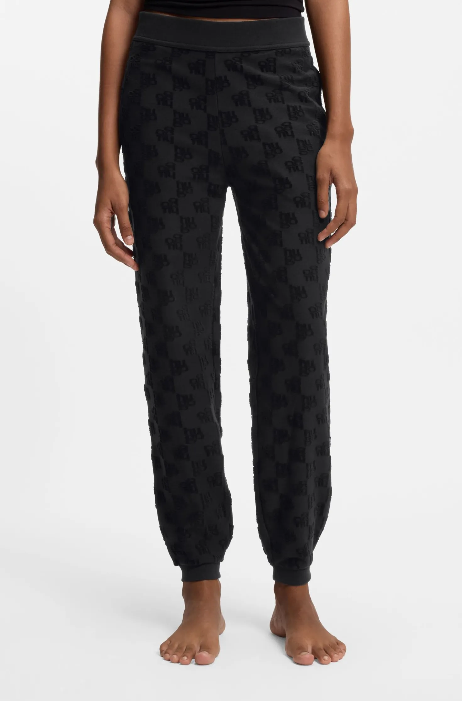 Cotton-blend tracksuit bottoms with all-over logo pattern