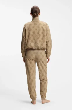Cotton-blend tracksuit bottoms with all-over logo pattern