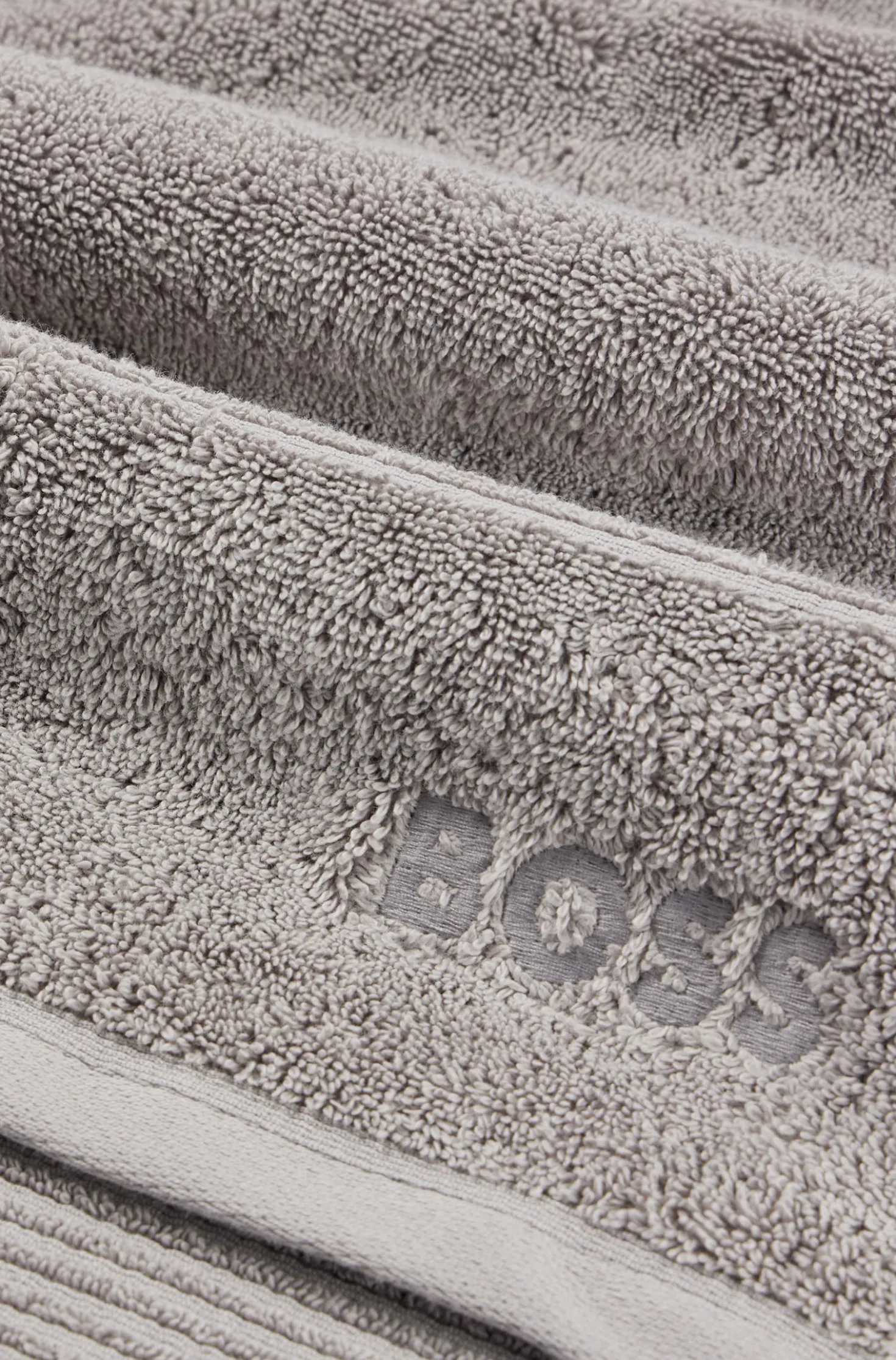 Cotton guest towel in silver with embroidered logo