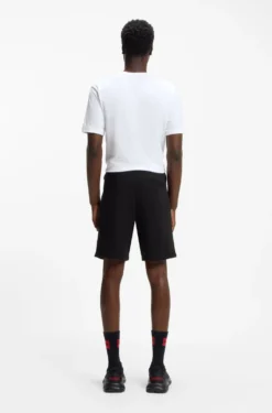 Cotton-terry shorts with red logo label