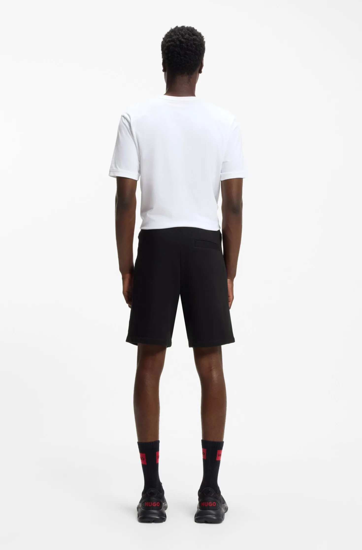 Cotton-terry shorts with red logo label