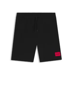 Cotton-terry shorts with red logo label