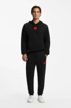 Cotton-terry tracksuit bottoms with red logo label