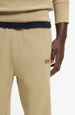 Cotton-terry tracksuit bottoms with logo badge