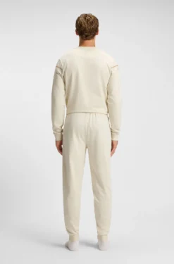 Cotton-terry tracksuit bottoms with tape and logo