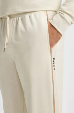 Cotton-terry tracksuit bottoms with tape and logo