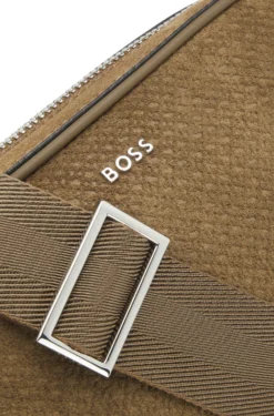 Crossbody bag in monogram-embossed suede
