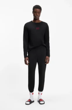 Cuffed loungewear bottoms in stretch cotton with logo print