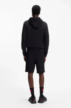 Cuffed loungewear bottoms in stretch cotton with logo print