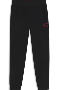 Cuffed loungewear bottoms in stretch cotton with logo print