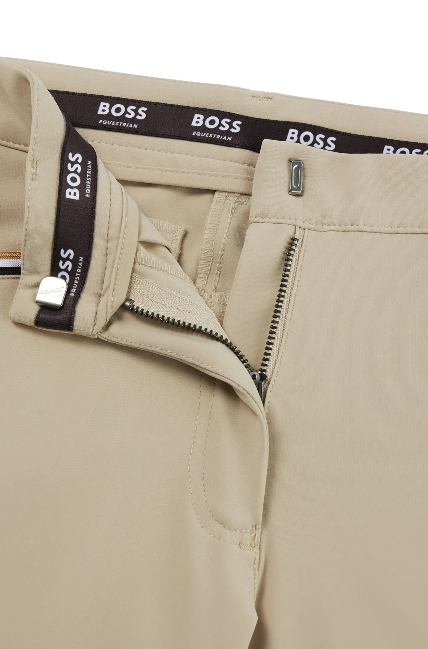 Equestrian knee-grip breeches in power-stretch material