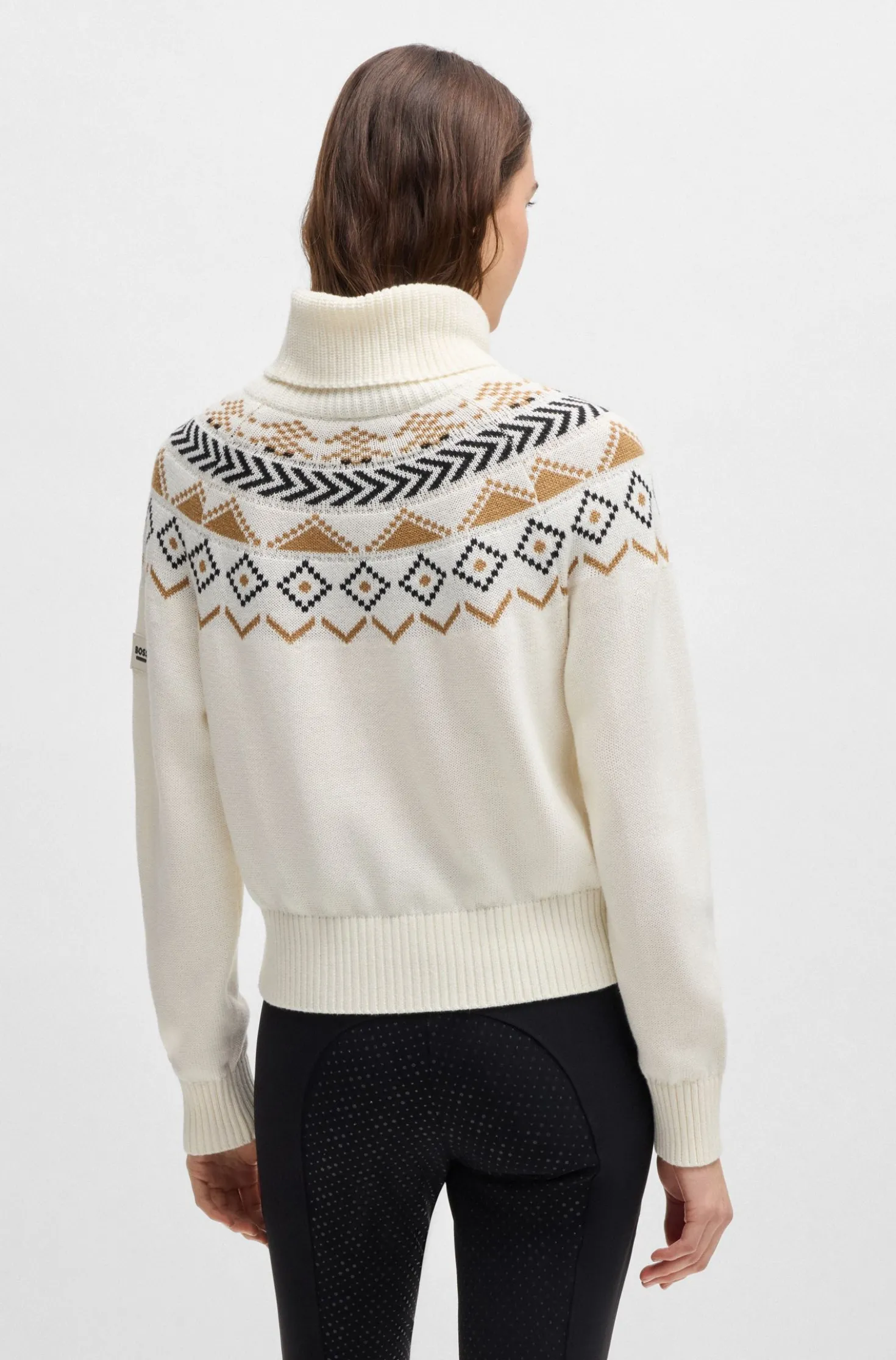 Equestrian rollneck sweater with knitted pattern