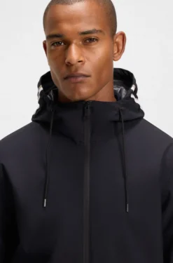 Equestrian waterproof jacket with adjustable hood