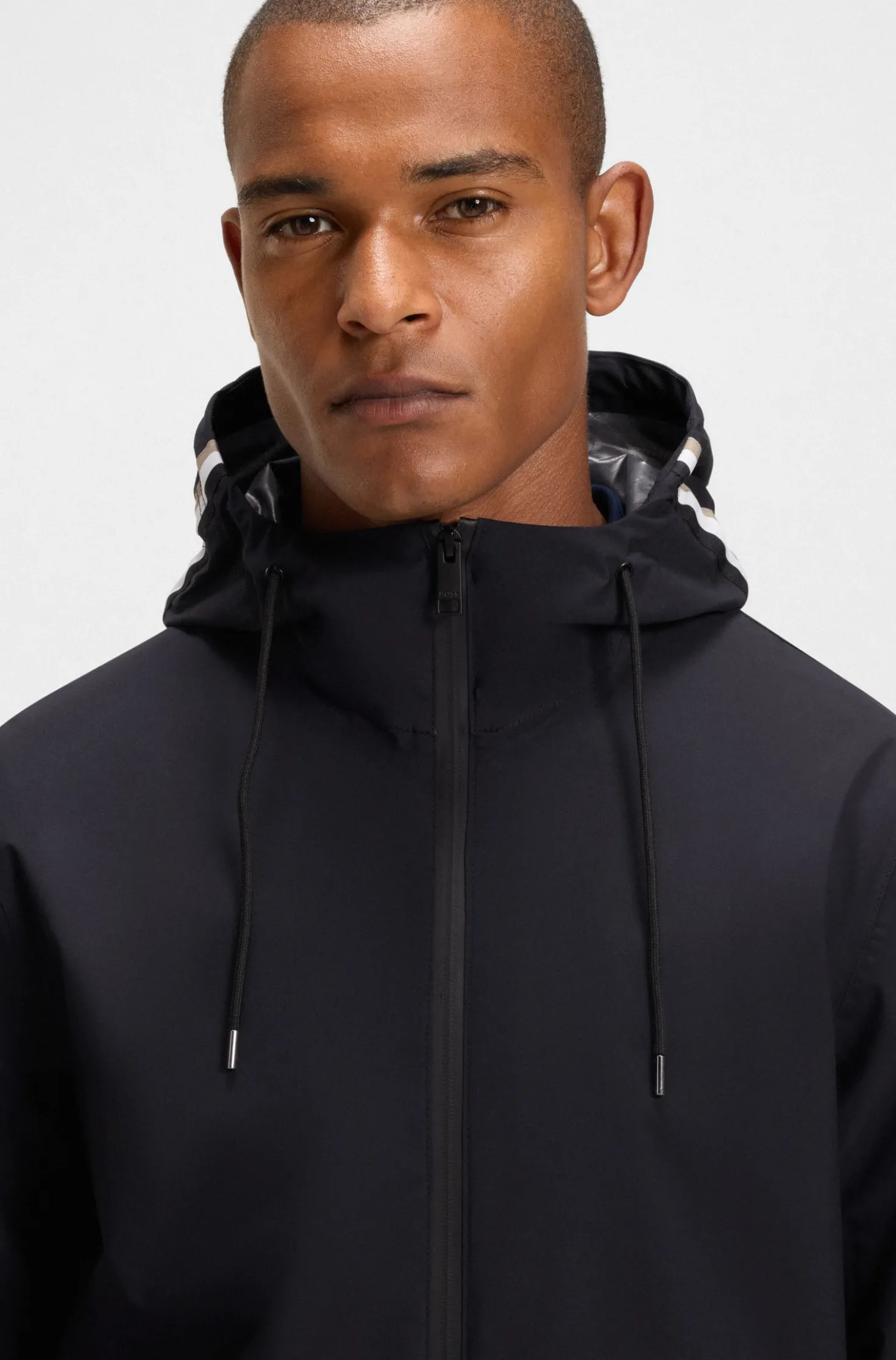 Equestrian waterproof jacket with adjustable hood
