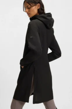 Equestrian waterproof raincoat with adjustable rear zips