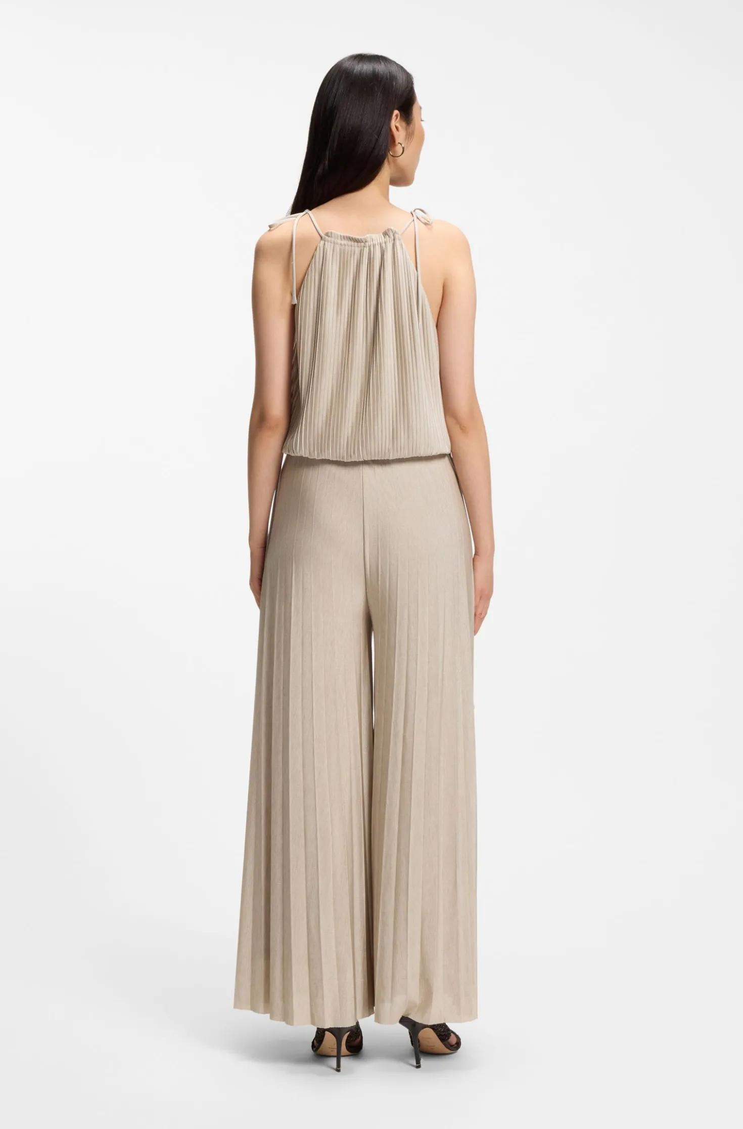 Halterneck jumpsuit in lustrous jersey with plissé pleats