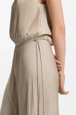 Halterneck jumpsuit in lustrous jersey with plissé pleats