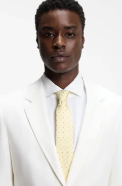 Italian-made tie in silk with jacquard-woven dots