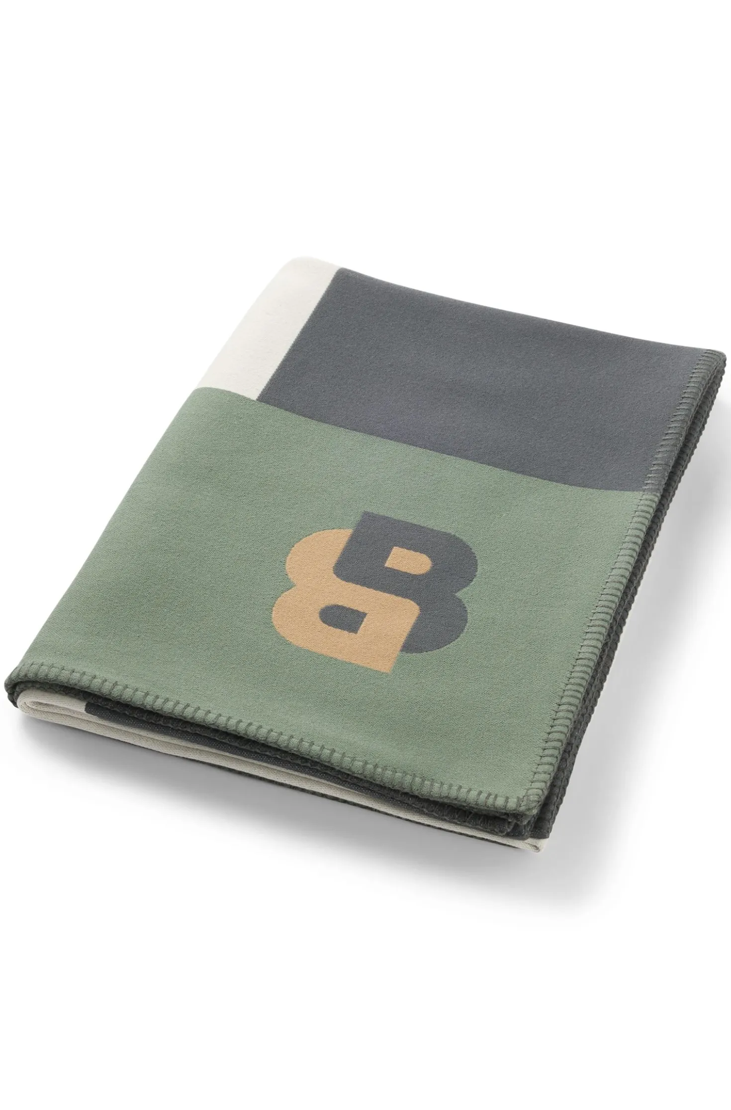 Jacquard throw with whipstitching