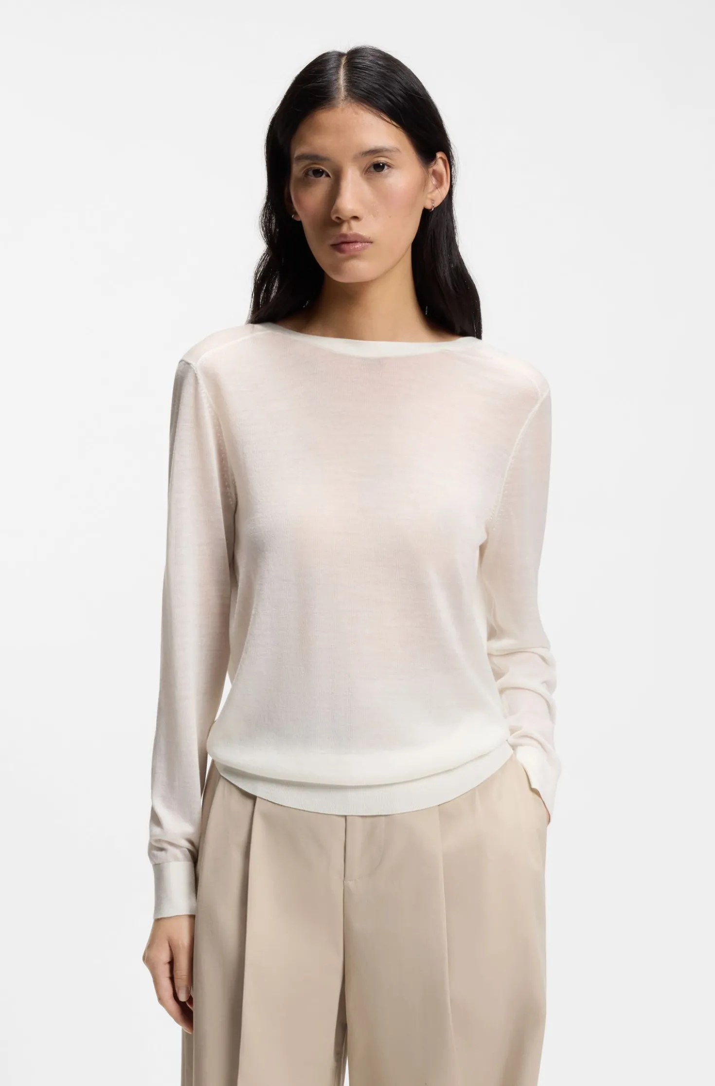 Knitted cardigan with rear button closure
