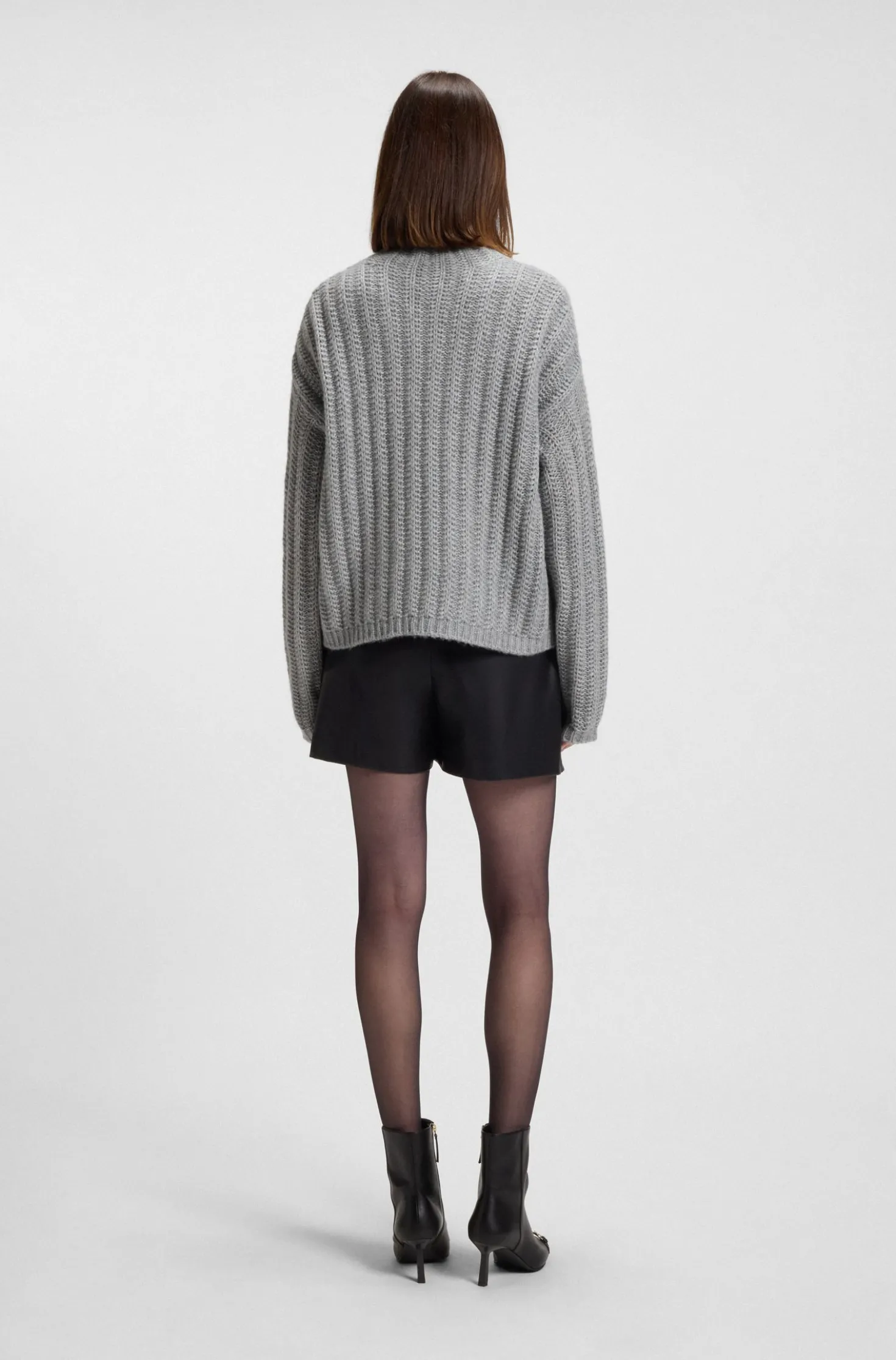 Knitted sweater with ribbed structure