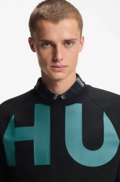 Loose-fit T-shirt in cotton jersey with wraparound logo