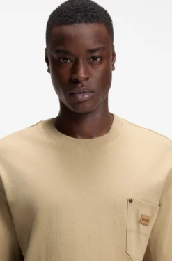 Loose-fit T-shirt in cotton with suede logo badge