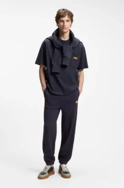 Loose-fit T-shirt in cotton with suede logo badge