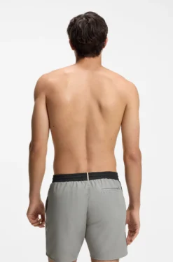 Medium-length swim shorts with contrast details