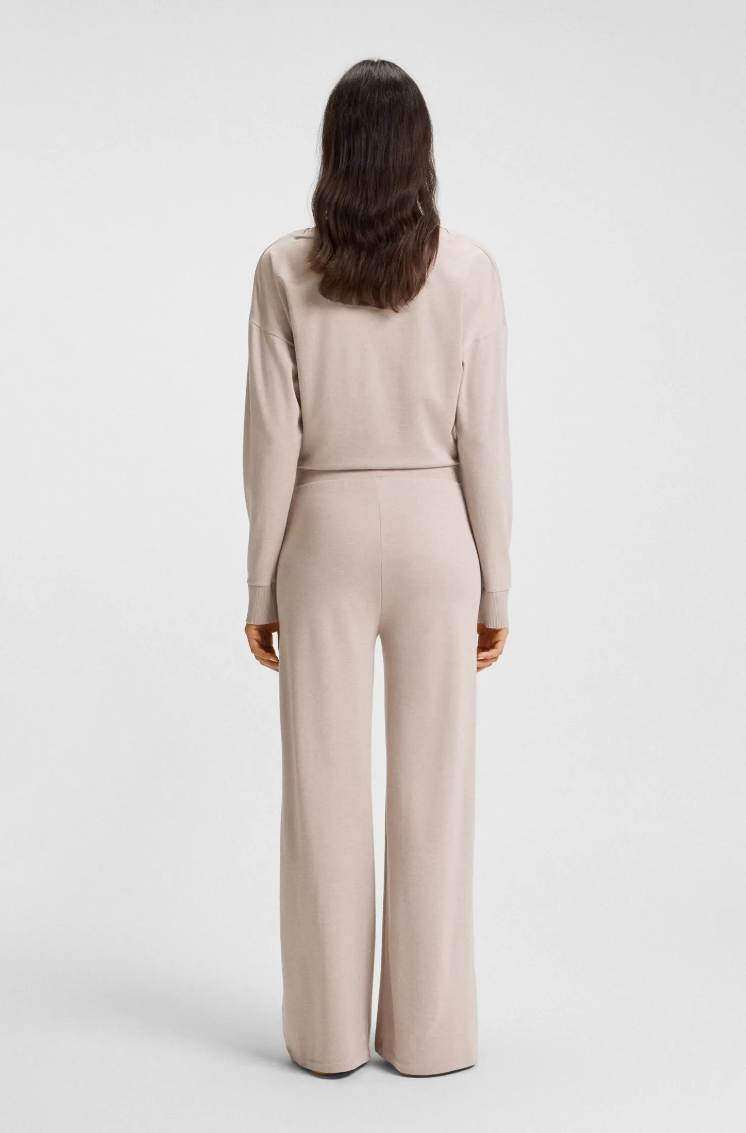 Melange-jersey tracksuit bottoms with logo plate