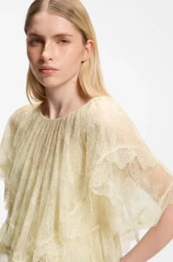Mini cape blouse with lace trimmings