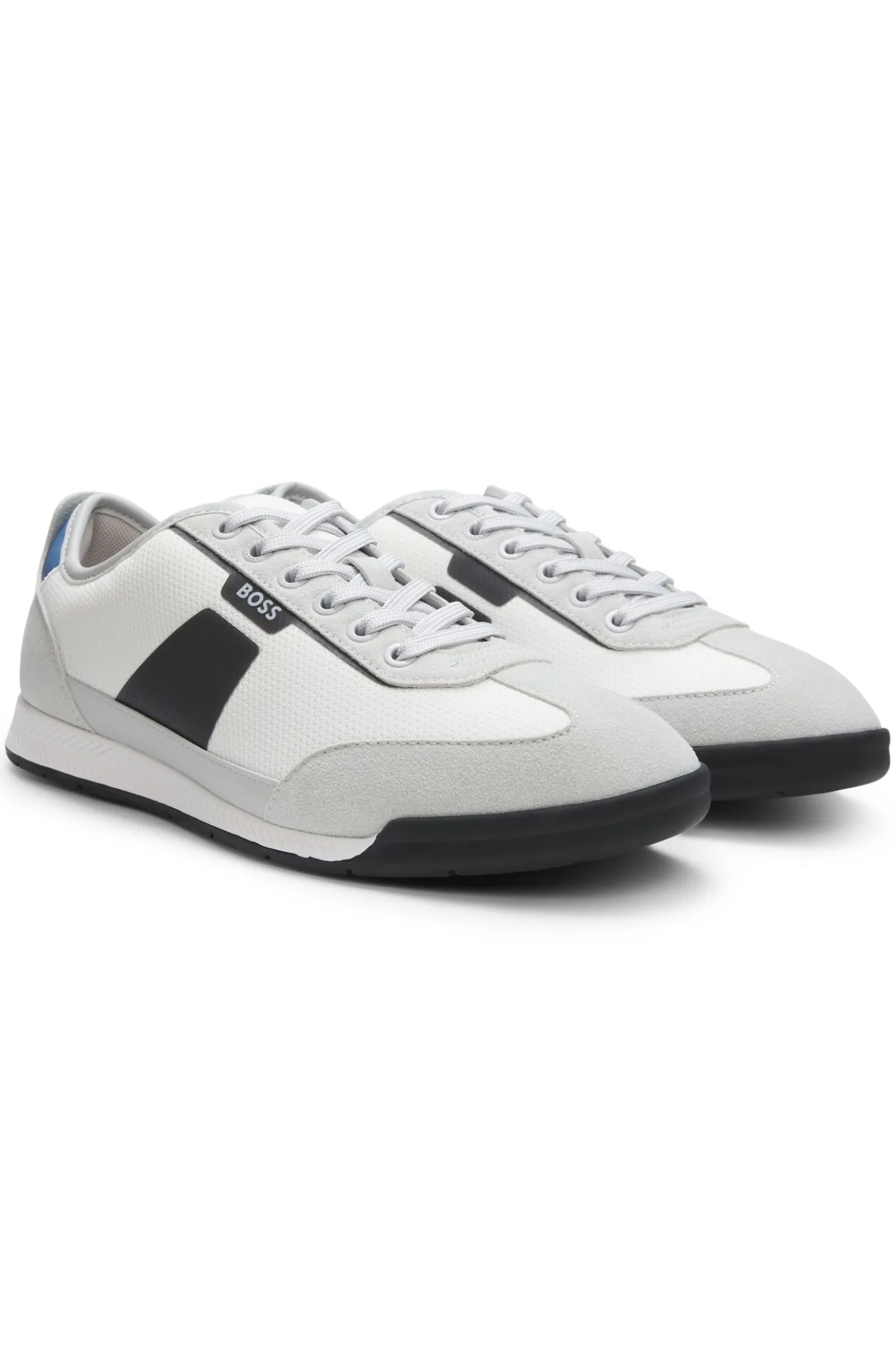 Mixed-material trainers with ridged outsole