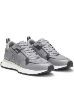Mixed-material trainers with mesh details and branding