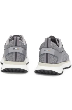 Mixed-material trainers with mesh details and branding