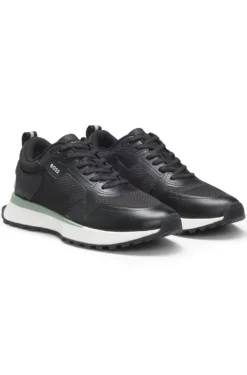 Mixed-material trainers with mesh details and branding