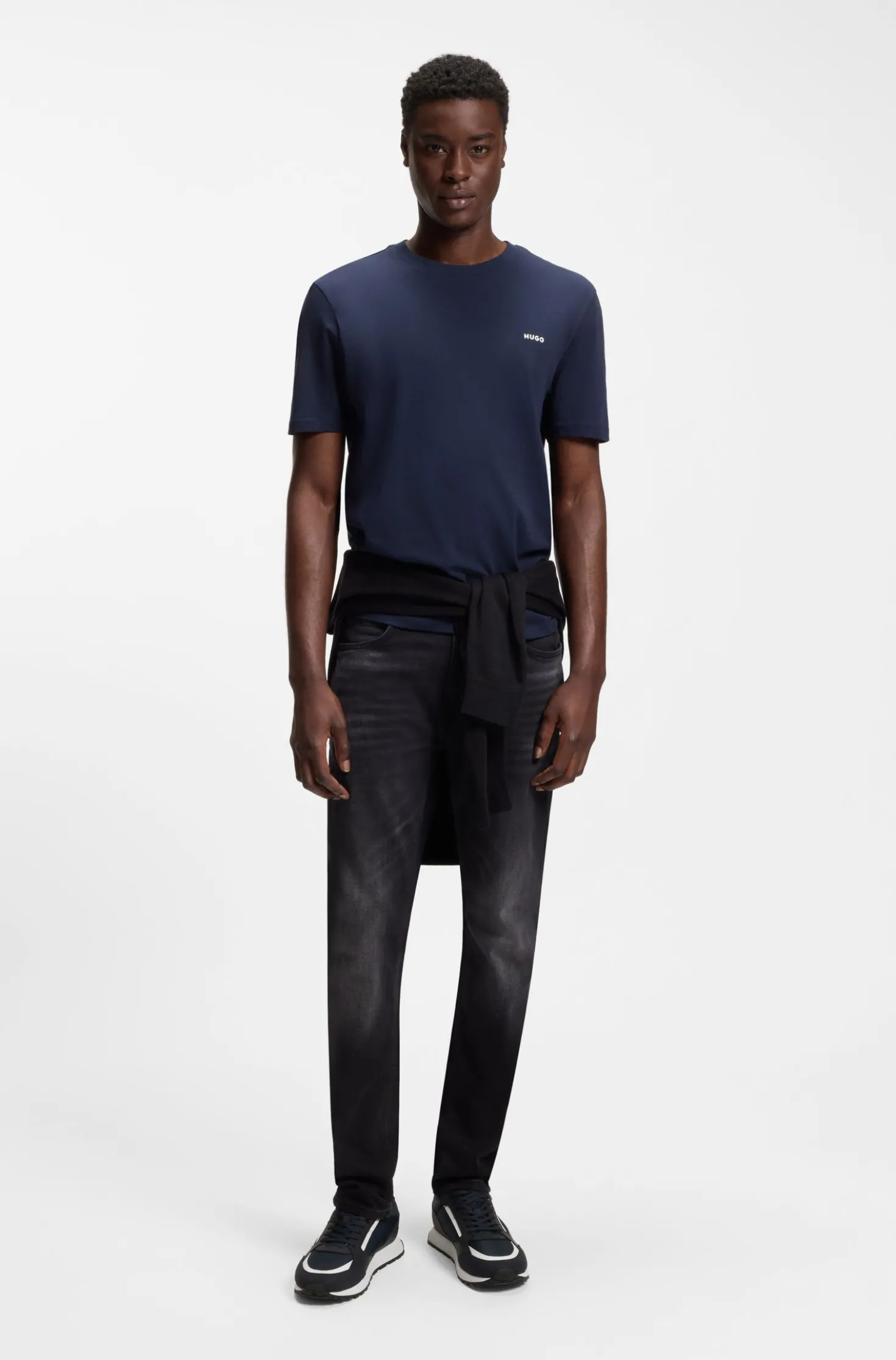Mixed-material trainers with branded accents