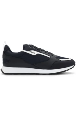 Mixed-material trainers with branded accents