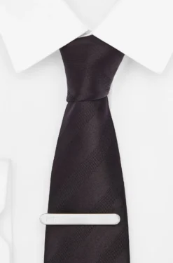 Oval-shaped tie clip with engraved logo