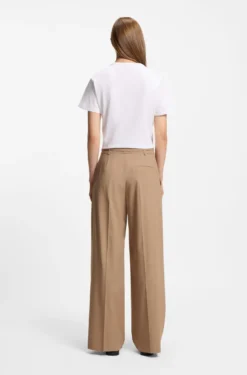 Pleat-front trousers with buckled belt